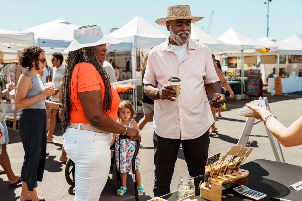 Outdoor market with people shopping
